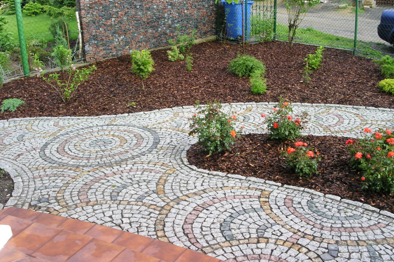 Curved stone pathway and garden borders